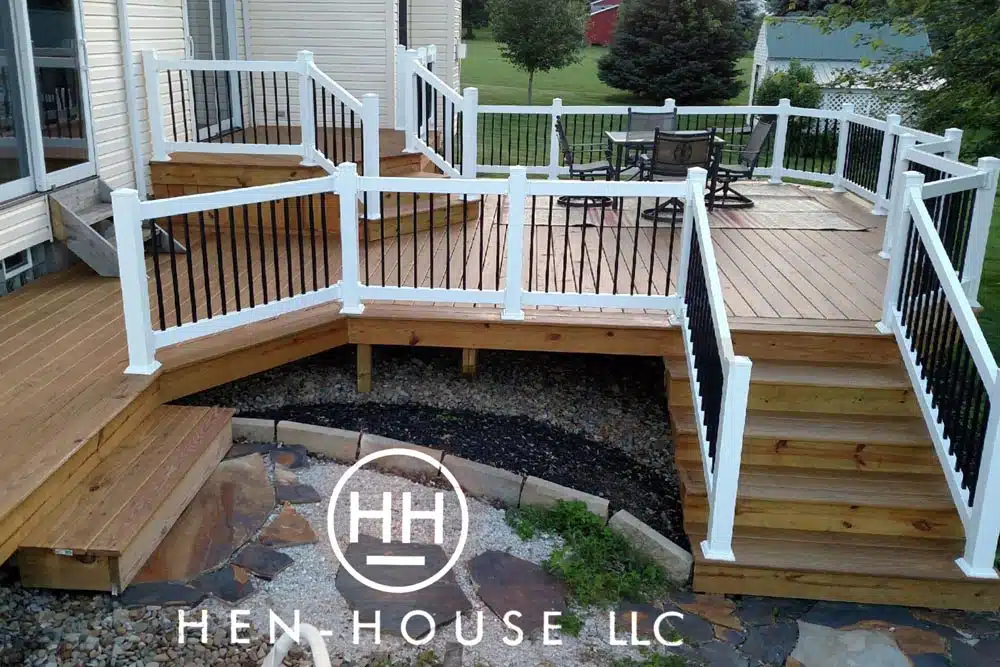 Wooden deck with a white railing system in summit county