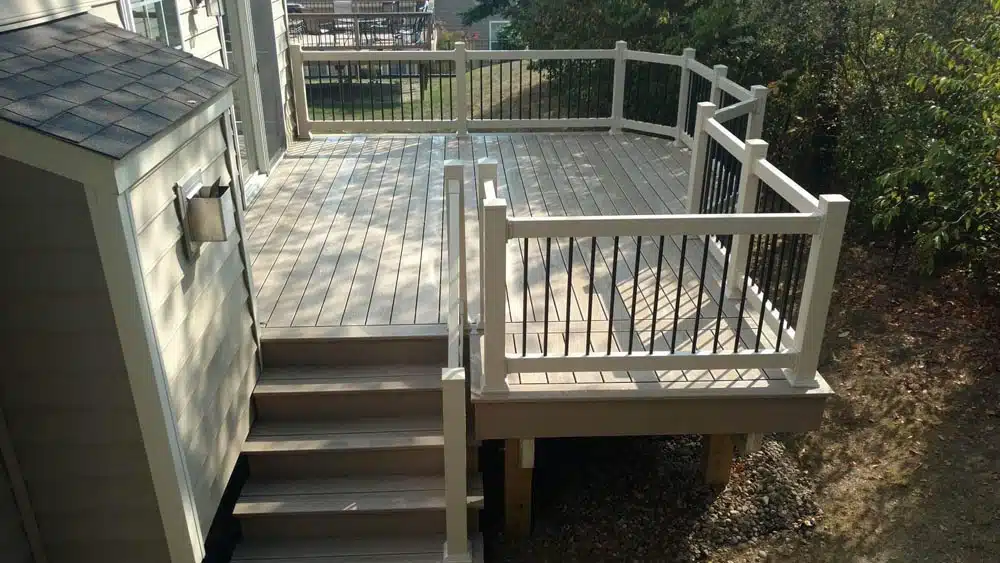 Octagonal deck section with dark stained wood and built-in bench seating.