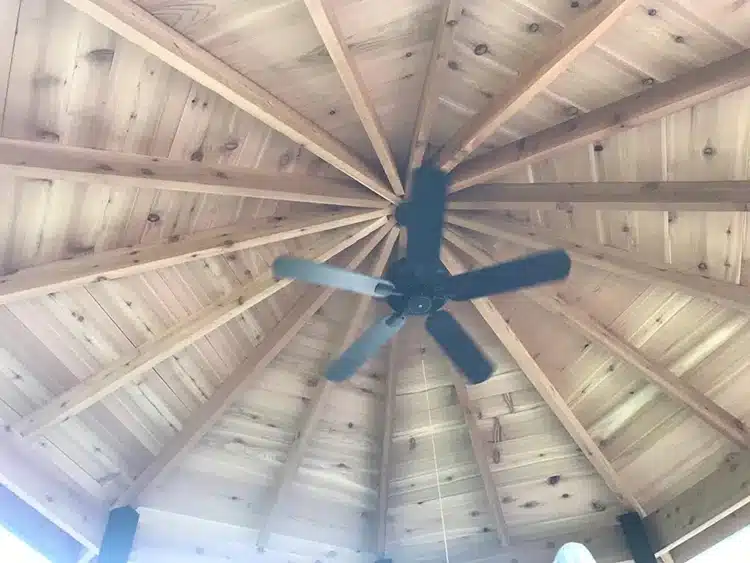 Photo of the interior of a gazebo roof with ceiling fan