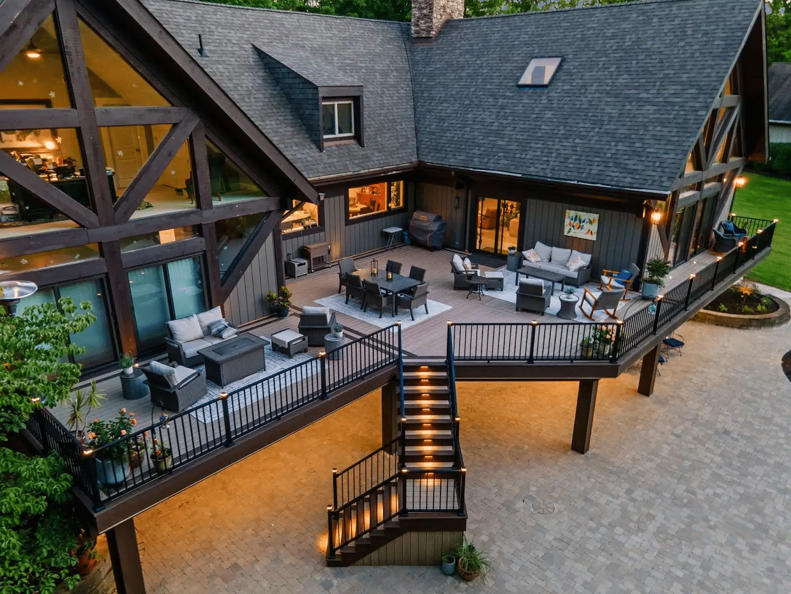 photo of elevated deck with the best composite deck boards, outdoor furniture, and patio below